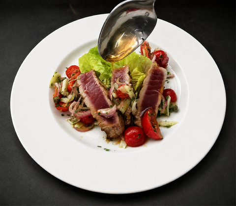 Photograph of a plate of KATZ tuna with tomatoes, herbs, and KATZ Late Harvest Sauvignon Blanc vinegar